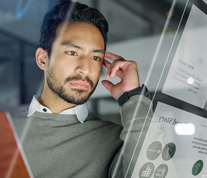 Man with computer monitors