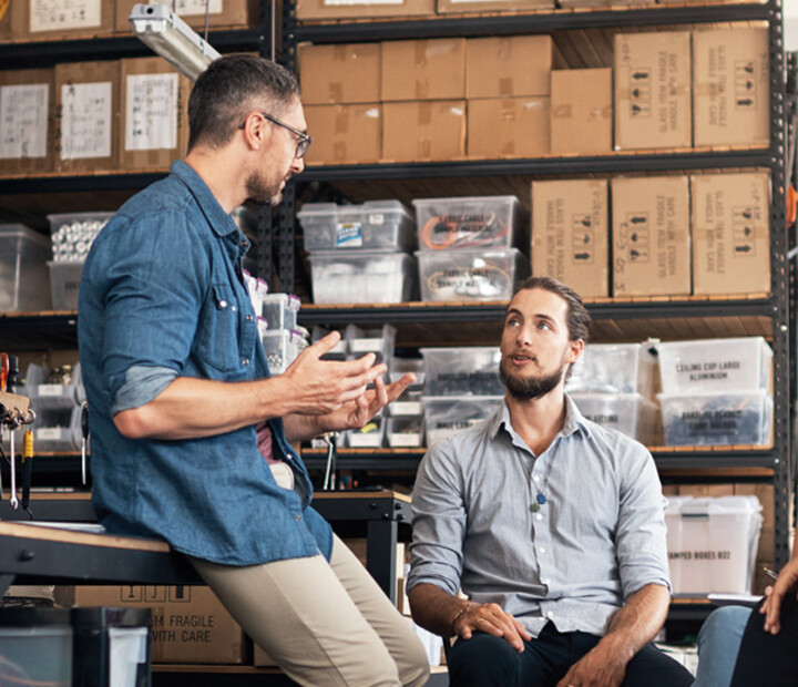 A group of colleagues having a discussion in a workshop