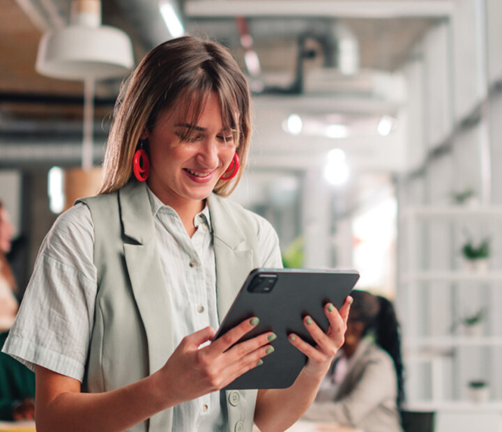 Businesswoman using tablet in modern office