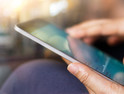 Worker using a tablet outside of th eoffice