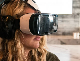 Woman using a Samsung Gear VR headset