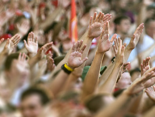 Football fans clapping on the podium of the stadium
