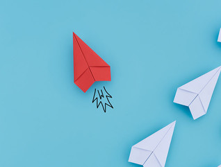 Group of paper planes in one direction and with one individual pointing in the different way. Business concept for innovative solution.