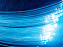 Bundle of optical fibers with lights in the ends.