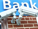 A bank protects its customers with two IP-enabled surveillance cameras