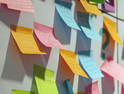 Gathering all the stakeholders on multi-colored sticky notes to generate ideas and create business plans