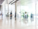 bank building lobby blur background interior view toward reception hall, modern luxury white room space with blurry corridor and building glass wall window