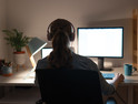 Woman using computer at home.