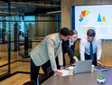 Business people working in a modern office board room