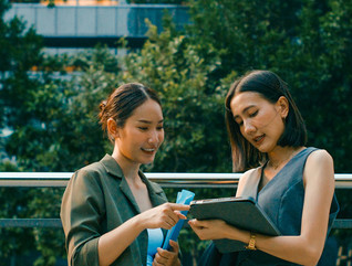Coworkers collaborate outside of a sustainable office 