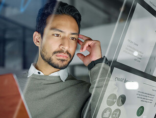 Man with computer monitors