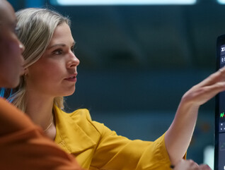 Two women discuss financial topics