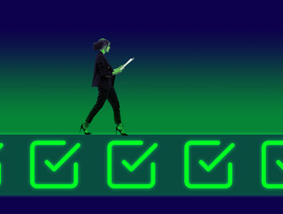 Businessperson walking on neon colored icons