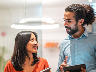 Colleagues talking at work 