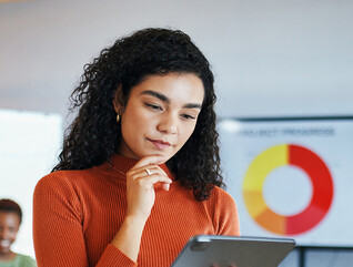 Person reviewing data via tablet