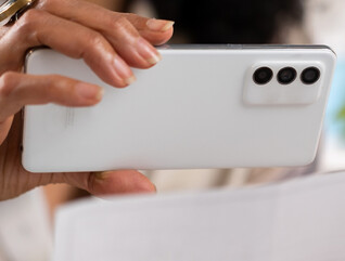 Person depositing check with cell phone