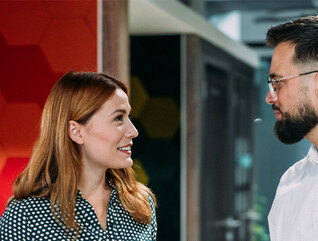 Co-workers talking in the office