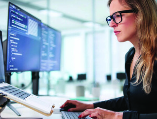 Employee reading computer screen