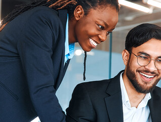 IT leaders working together in office space
