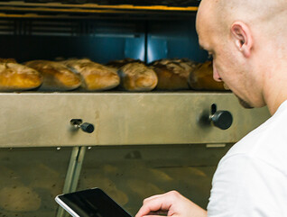 Baker using digital tablet
