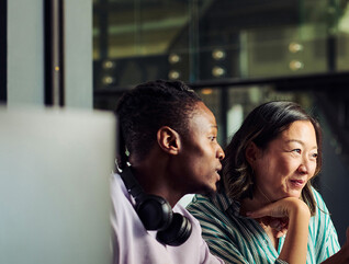 2 people at computer screens
