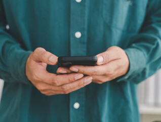 Businessman holding smartphone