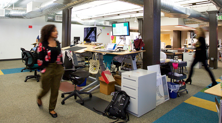 A  wide angle photo people in of the office of the nonprofit Wikimedia Foundation in San Francisco.