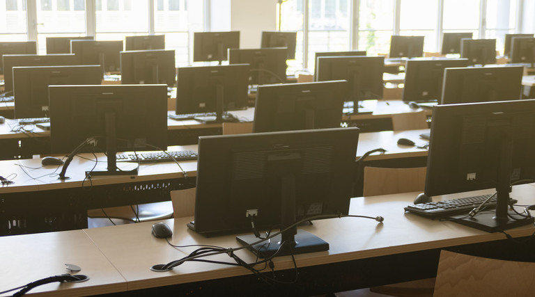 Classroom of many desktop computers.