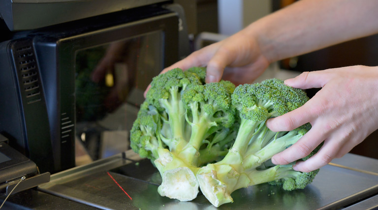 Broccoli being checked out at a self-serve checkout