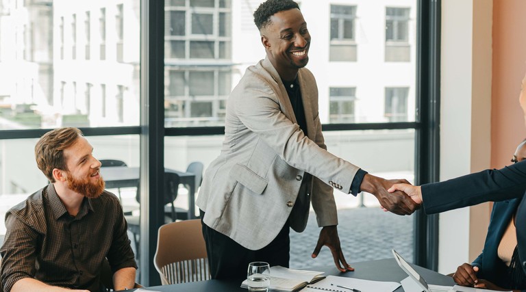 client handshake in business meeting