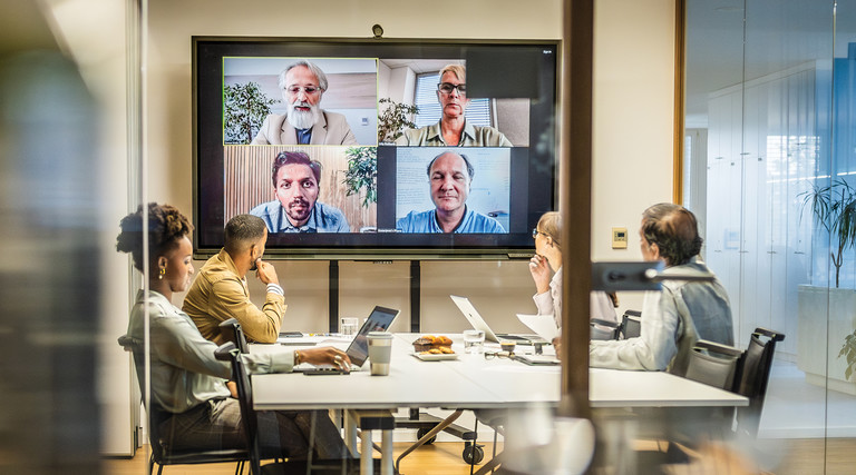 Coworkers in a conference room space