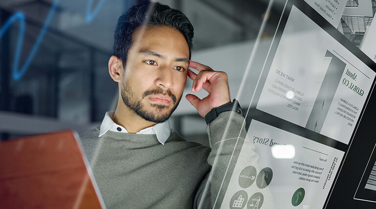 Man with computer monitors