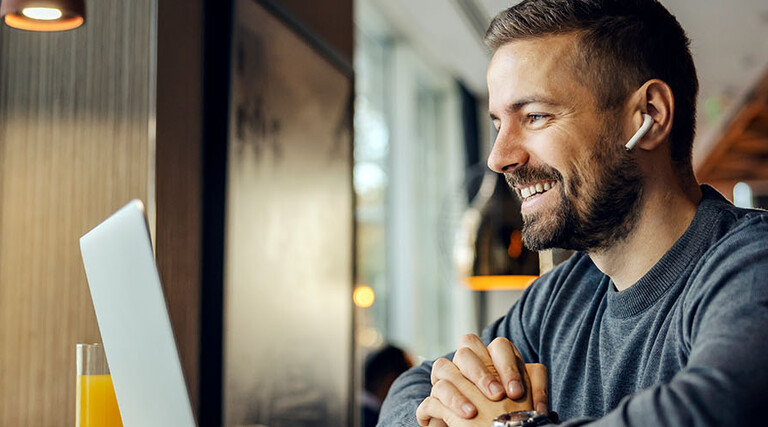 Freelancer sitting having conference call with client