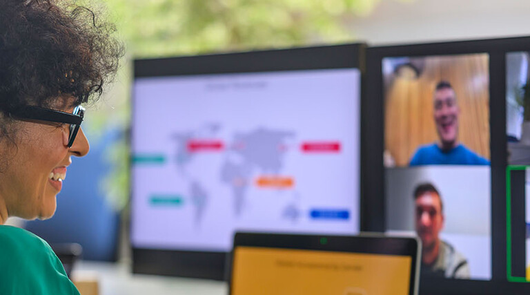 Businessperson with colleagues during conference call