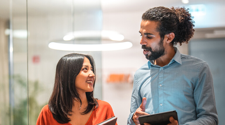 Colleagues talking at work 
