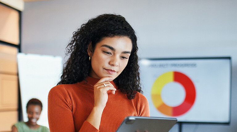 Person reviewing data via tablet