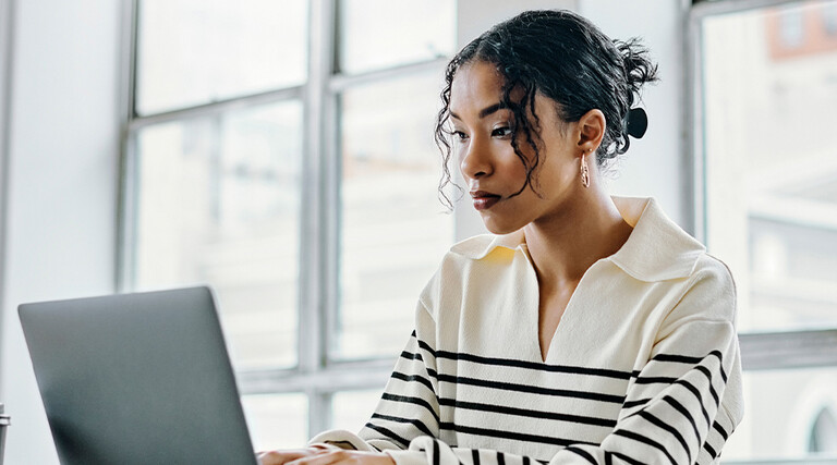 Person using laptop in the office