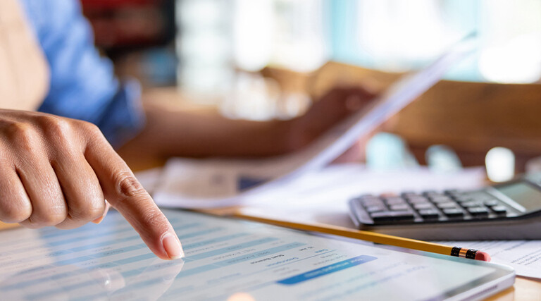 Person calculating business expenses