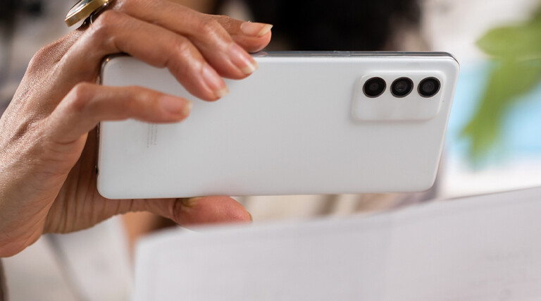 Person depositing check with cell phone