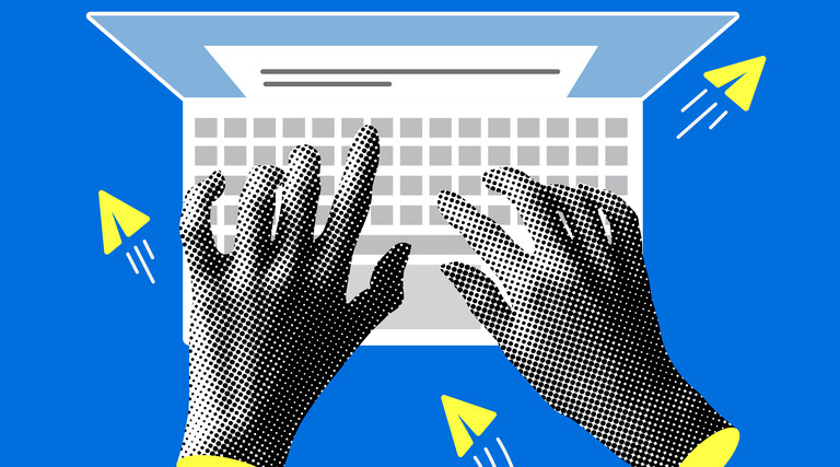 Hands typing on a computer