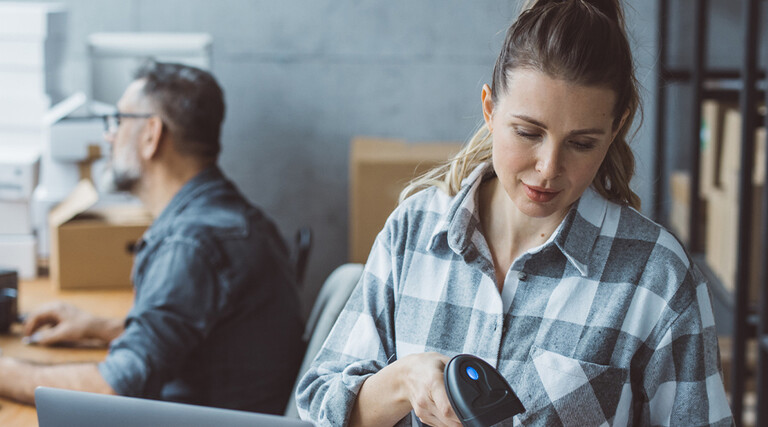 Small business owners processing orders