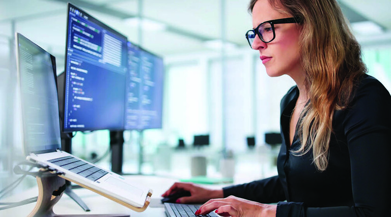 Employee reading computer screen