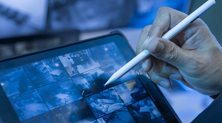 Security guard using tablet