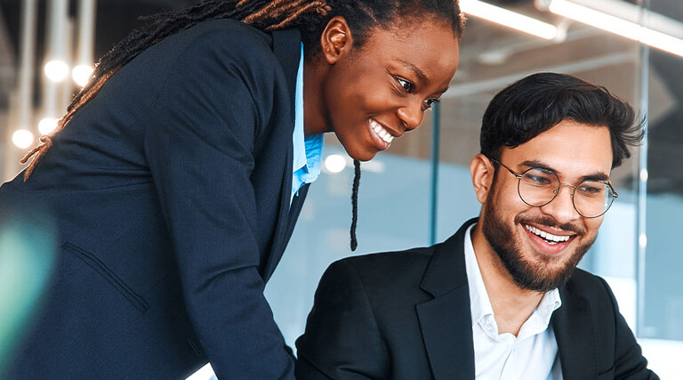 IT leaders working together in office space