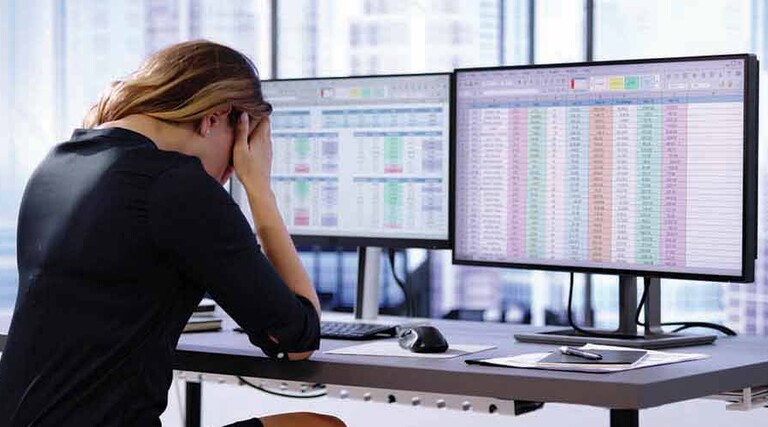 Person working on spreadsheet
