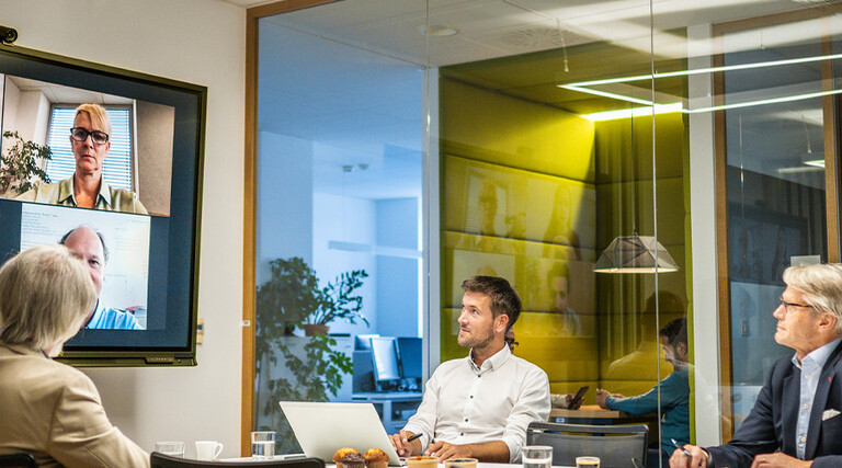 People in a hybrid workspace