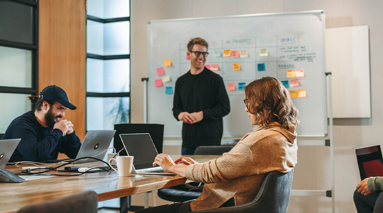 Person leading a meeting in the office