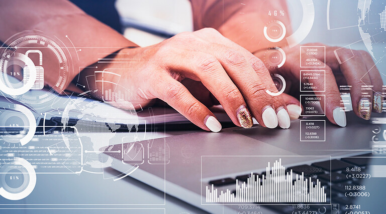 Business women typing on laptop.