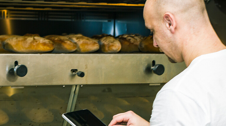 Baker using digital tablet