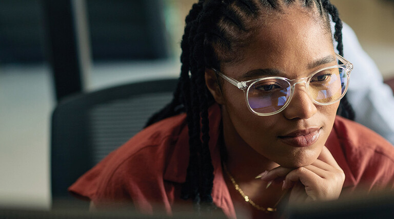 A business leader is coding